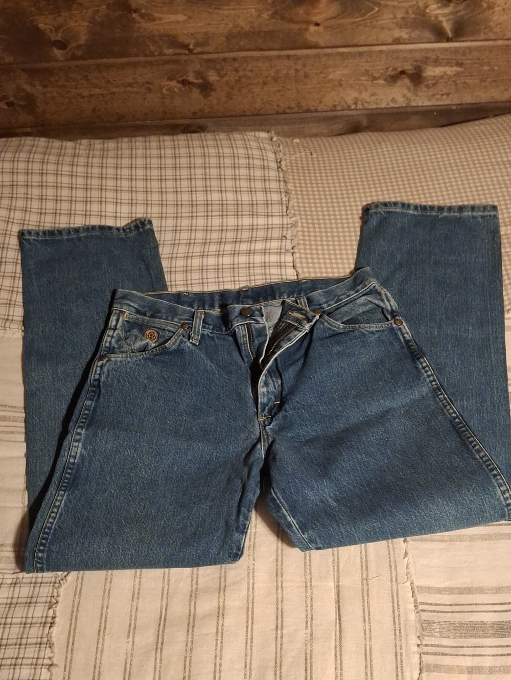 Classic Wrangler relaxed-fit jeans. Durable denim with five-pocket styling. Comf
